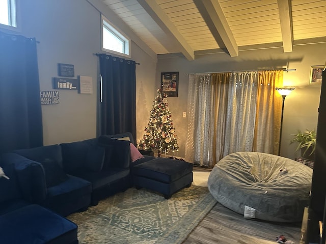 living room with vaulted ceiling with beams and hardwood / wood-style floors