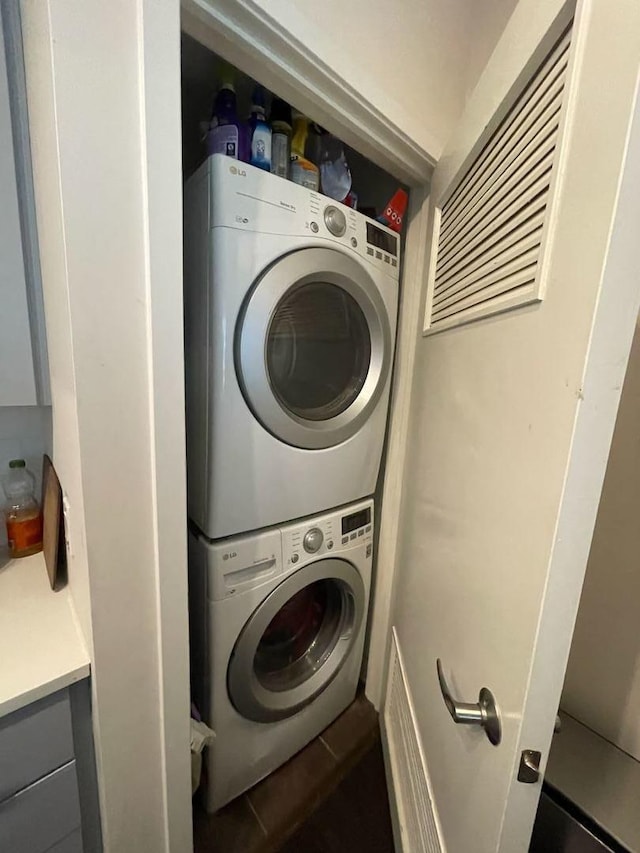 505 N Mcclurg Ct Unit 1101, Chicago, IL 60611 - laundry area with estacked washer and dryer and tile patterned floors