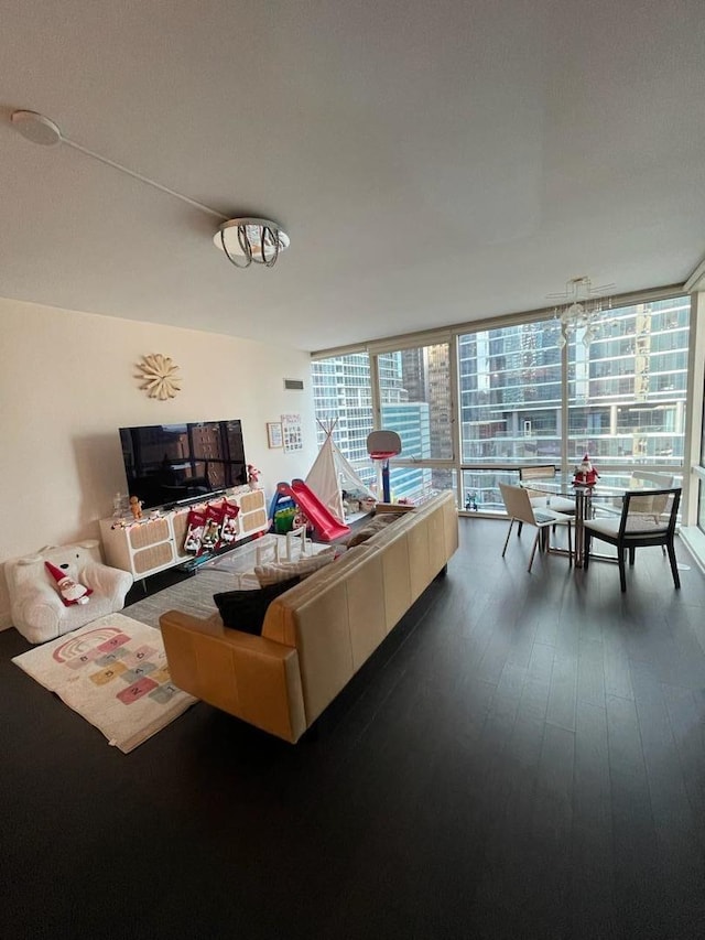 living room featuring wood-type flooring and expansive windows