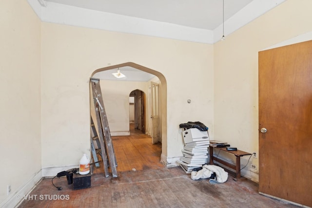 corridor with wood-type flooring