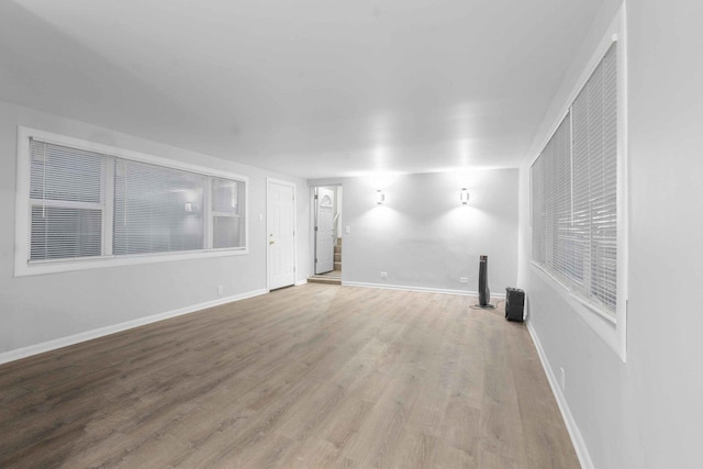 unfurnished living room with hardwood / wood-style floors