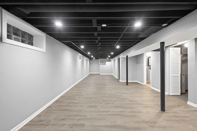 basement featuring light hardwood / wood-style flooring