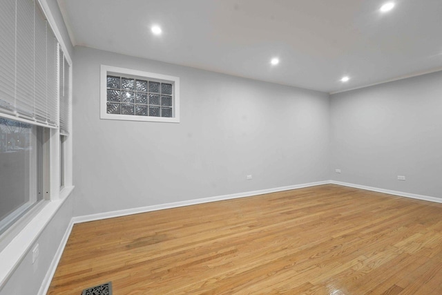 spare room with light wood-type flooring