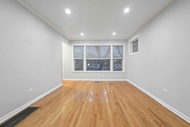 unfurnished room featuring light wood-type flooring