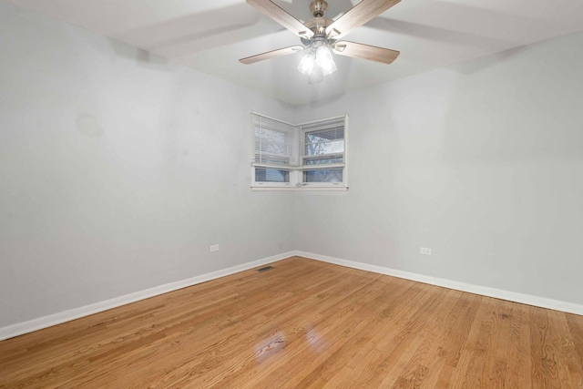 unfurnished room with light wood-type flooring and ceiling fan