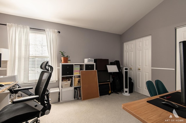 home office with light carpet and lofted ceiling