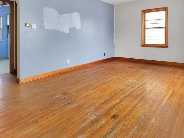 unfurnished room with light hardwood / wood-style flooring