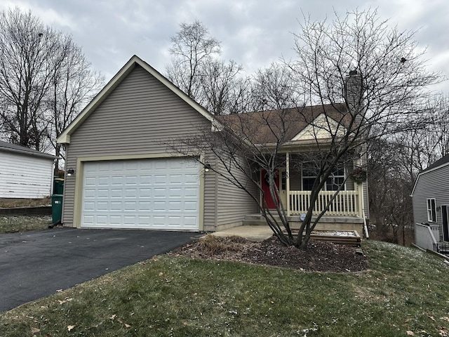 view of front facade with a front lawn, a porch, and a garage