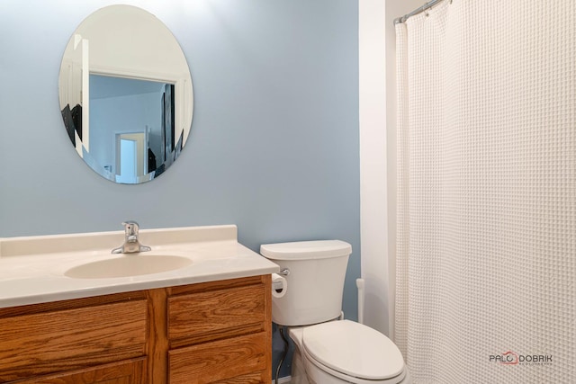 bathroom with toilet and vanity