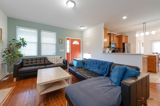 living room with light hardwood / wood-style flooring