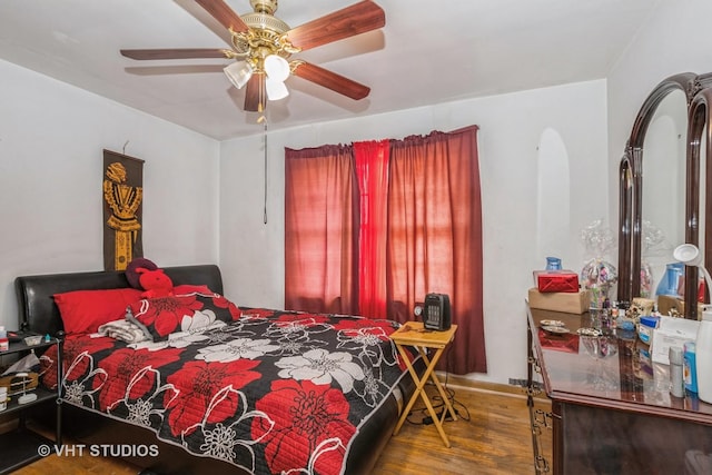 bedroom featuring hardwood / wood-style flooring and ceiling fan