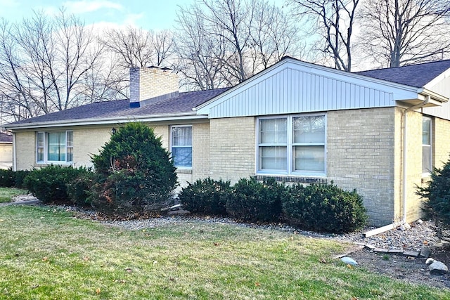 view of side of property featuring a yard