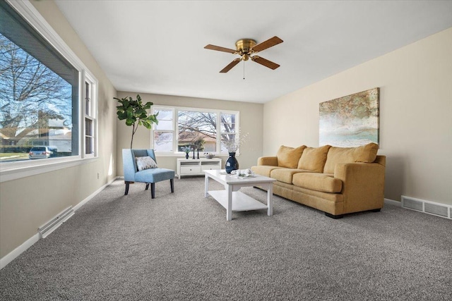 carpeted living room featuring ceiling fan