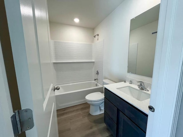 full bathroom with hardwood / wood-style floors, vanity, toilet, and shower / bathtub combination