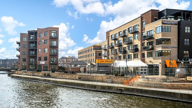 view of building exterior with a water view