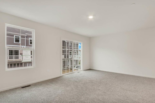 spare room featuring carpet flooring