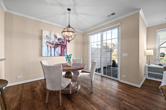 dining area featuring crown molding, dark wood-type flooring, and plenty of natural light