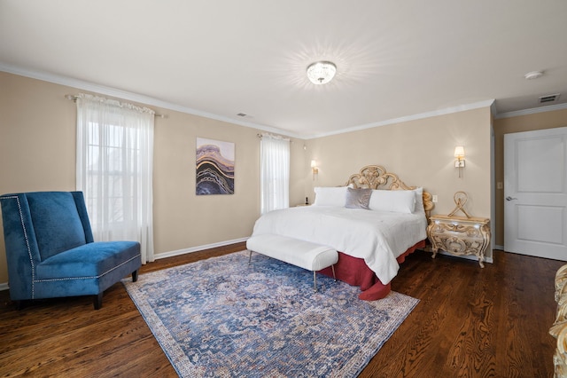 bedroom featuring crown molding and dark hardwood / wood-style flooring