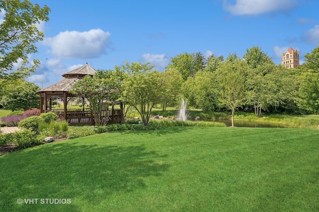 exterior space with a gazebo and a lawn