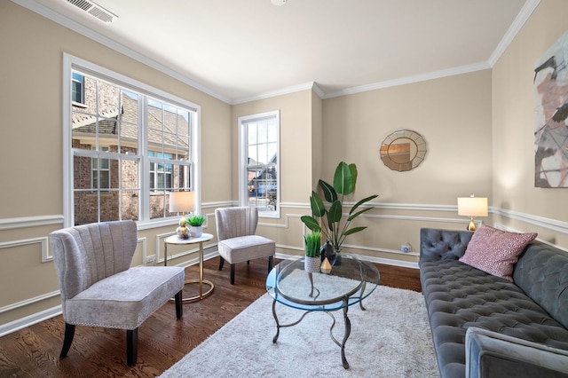 living room with ornamental molding and dark hardwood / wood-style floors