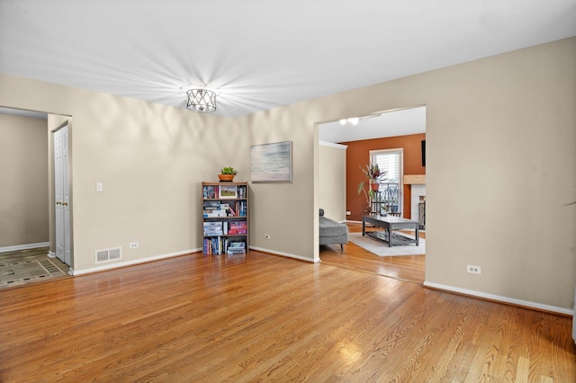 empty room with light hardwood / wood-style flooring