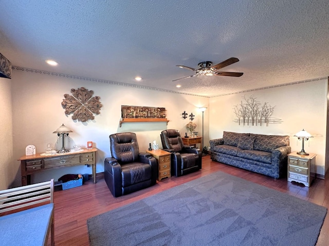 living room featuring a textured ceiling, dark hardwood / wood-style flooring, and ceiling fan