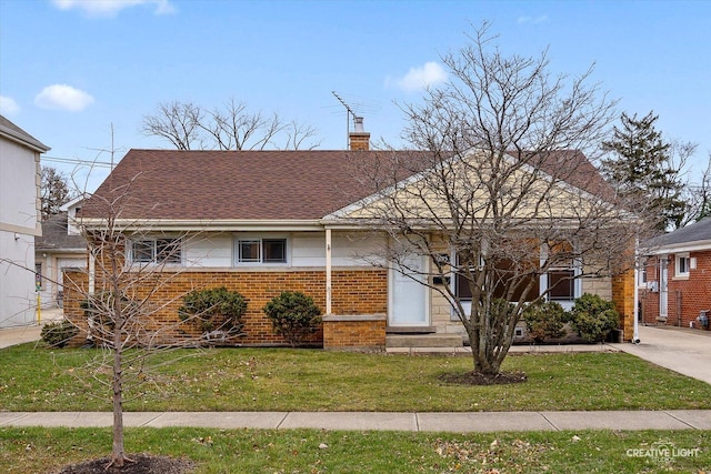 7825 N Oconto Ave, Niles, IL 60714 - view of front of house featuring a chimney, brick siding, a front lawn, and a shingled roof