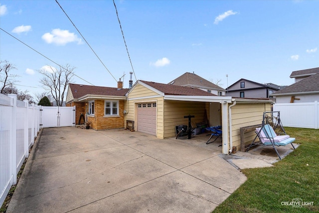 7825 N Oconto Ave, Niles, IL 60714 - back of house featuring a gate, driveway, brick siding, and an attached garage
