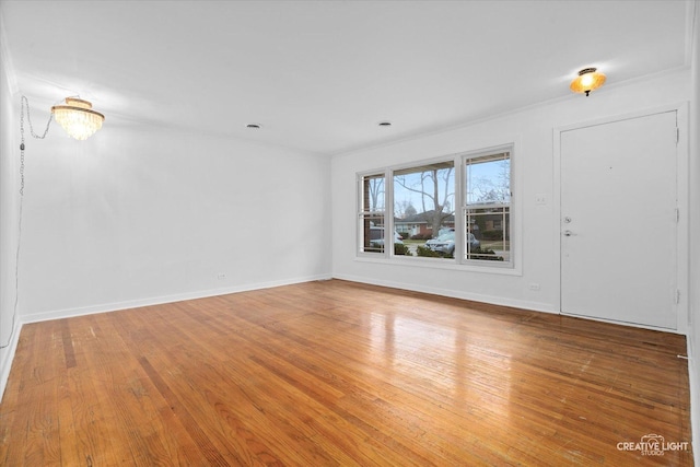 7825 N Oconto Ave, Niles, IL 60714 - empty room with wood finished floors and baseboards