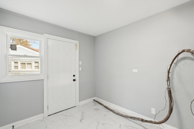 entryway featuring ornamental molding