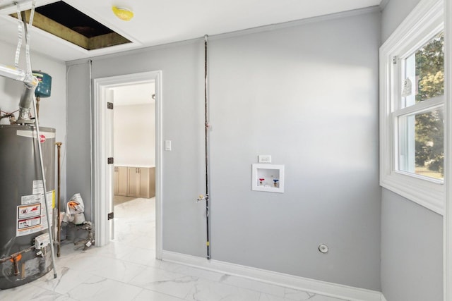 laundry area with gas water heater, crown molding, and hookup for a washing machine