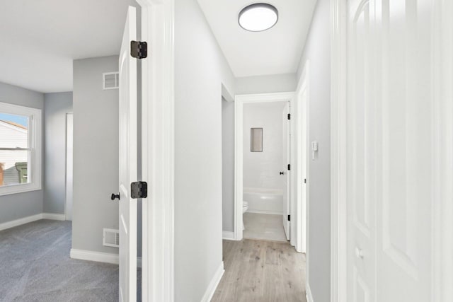 hallway with light wood-type flooring