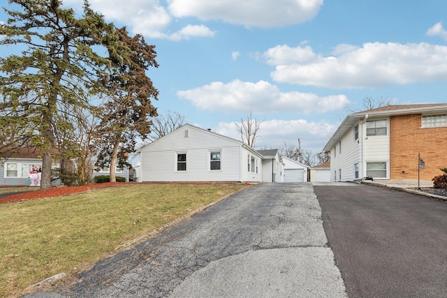 view of home's exterior with a yard and a garage