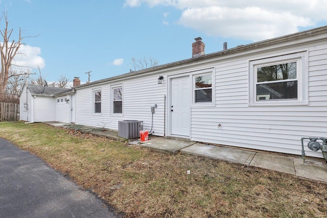 back of house with cooling unit