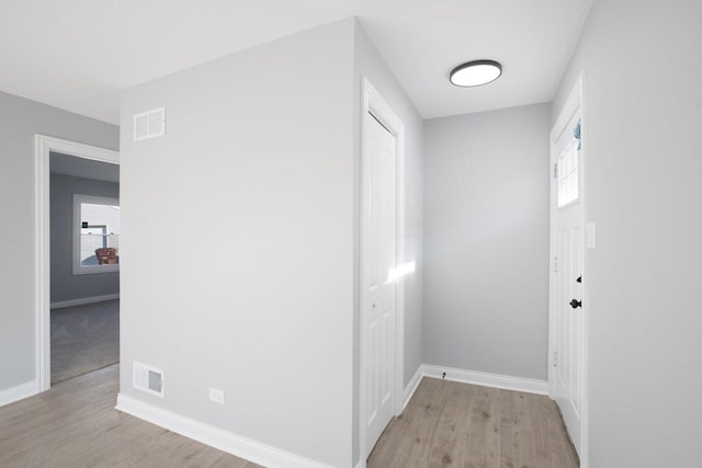 corridor featuring light hardwood / wood-style flooring