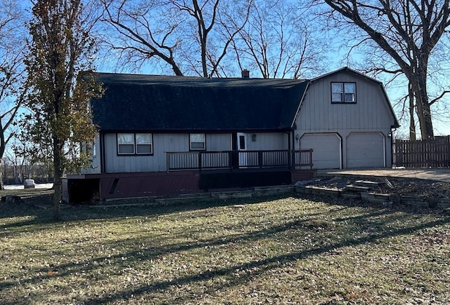 view of front facade with a front lawn and a wooden deck