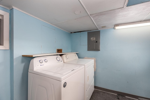 laundry area with electric panel and washing machine and clothes dryer