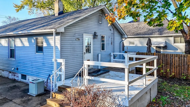 back of house with a wooden deck and central AC