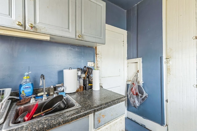 kitchen featuring gray cabinetry and sink