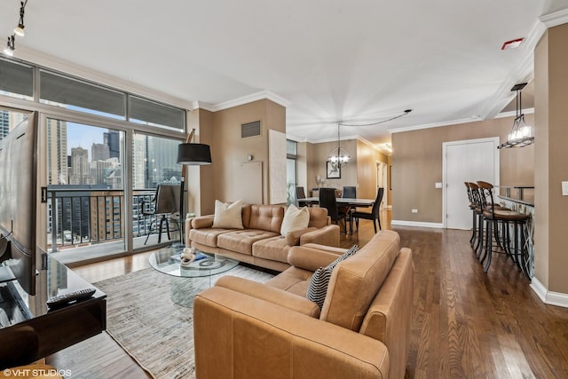 living room featuring floor to ceiling windows, dark hardwood / wood-style flooring, a notable chandelier, and ornamental molding