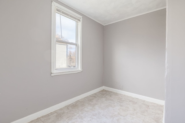 unfurnished room with crown molding