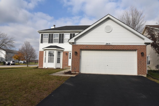 view of front of home featuring a garage and a front lawn