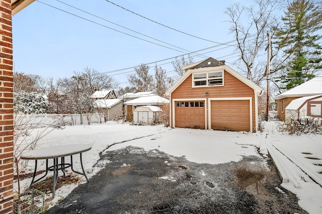 view of snow covered garage