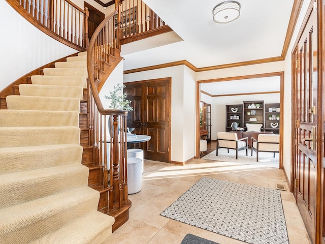 tiled entryway with ornamental molding