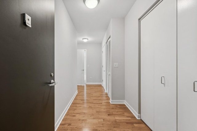 corridor featuring light hardwood / wood-style floors