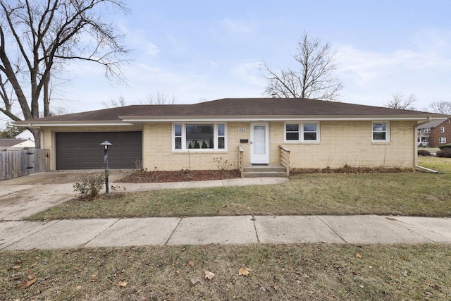 single story home featuring a front yard and a garage