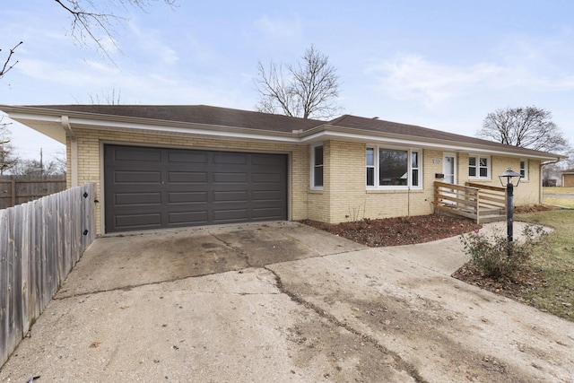 ranch-style home featuring a garage