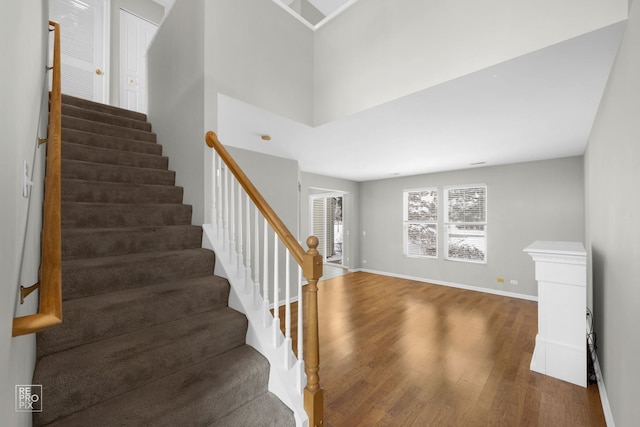 staircase featuring hardwood / wood-style flooring