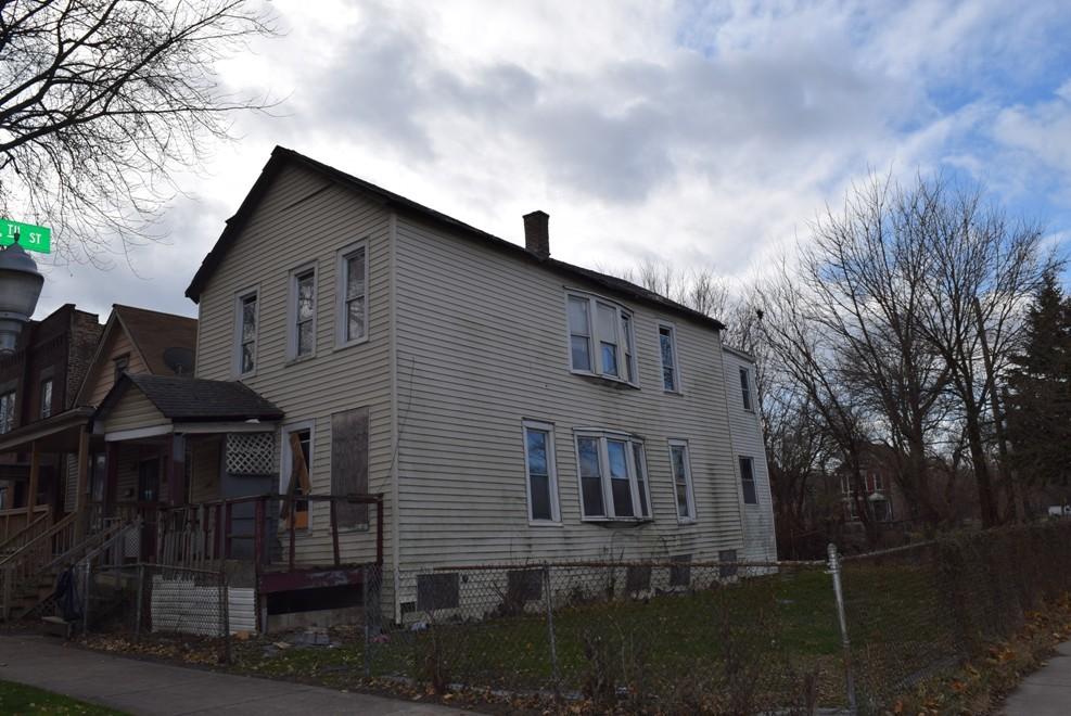 view of side of home with a porch