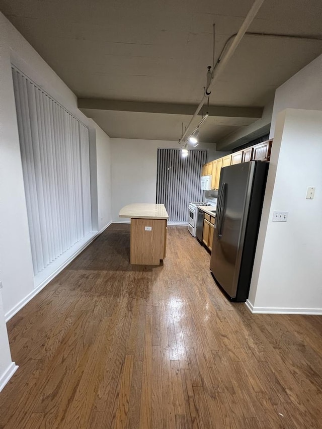 1525 S Sangamon St Unit 317P, Chicago, IL 60608 - kitchen with white appliances, a center island, dark wood finished floors, and light countertops